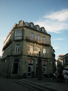 Vintage style building in Pontevedra, Spain, under a blue sky.